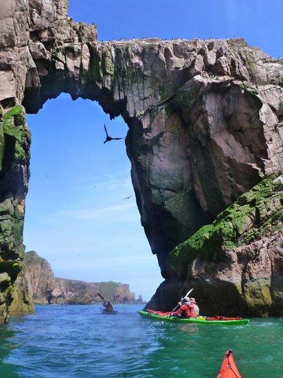 Kayaks off the coast of Port Erroll