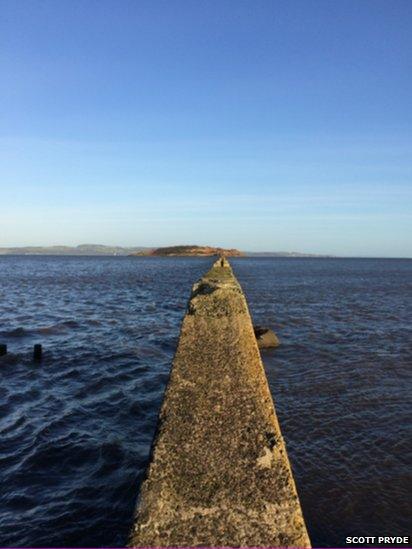 The causeway to Cramond Island at high tide.