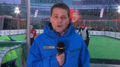 BBC Sport's Chris Mitchell takes one on the head while live on air