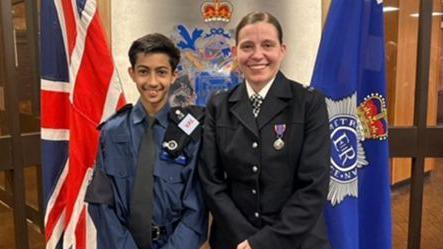 VPC Saavan Bhatt in his cadet uniform standing alongside PC Roma Wesolek