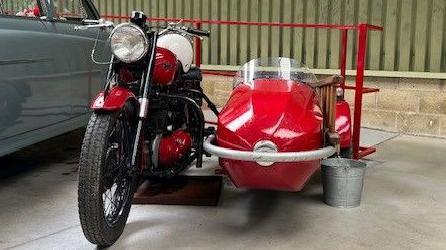 Red motorcycle and sidecar in a classic style