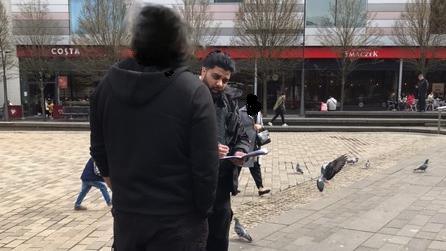 A person being fined in Luton for feeding pigeons