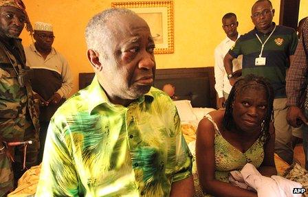 Laurent Gbagbo (left foreground) and his wife, Simone Gagbo, being held in an Abidjan hotel following their capture by forces loyal to Alassane Ouattara in April 2011