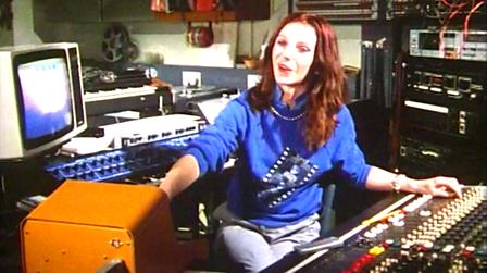 Elizabeth Parker surrounded by machines in the Radiophonic Workshop.