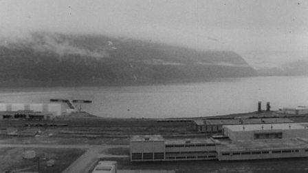 greyscale image of the deserted port of whittier in alaska