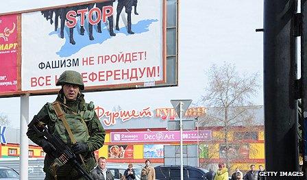 Russian soldier patrols Crimea