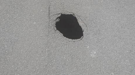 A sinkhole on a road