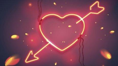 neon heart with arrow through it