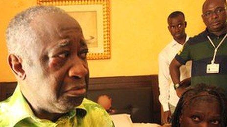 Laurent Gbagbo (left foreground) and his wife, Simone Gagbo, being held in an Abidjan hotel following their capture by forces loyal to Alassane Ouattara in April 2011