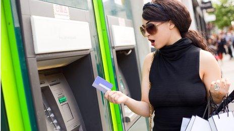 shocked lady at cashpoint
