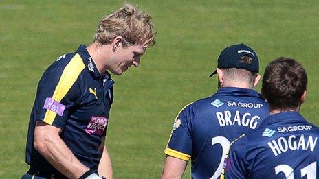 Jimmy Adams (left) with Glamorgan's Will Bragg and Michael Hogan (right)