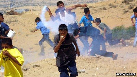 Palestinian youths clash with Israelis in the second Intifada in 2000