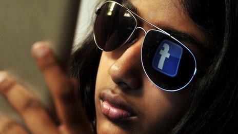 woman with Facebook logo in sunglasses