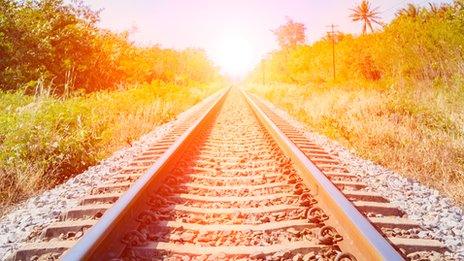 railway track stretching out into sunshine