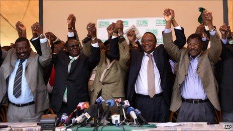 Kenyan cabinet ministers celebrate after provisional results showed that Kenyans had voted for a draft constitution they had campaigned for in Nairobi, Kenya