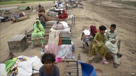 Pakistani villagers who fled from their homes due to heavy flooding are seen living on an embankment in Thatta, near Hyderabad, Pakistan, Tuesday, Aug. 24, 2010.