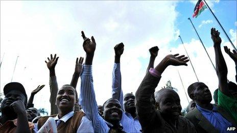 Kenyans cheer after an announcement of provisional results of Kenya's constitutional referendum in Nairobi