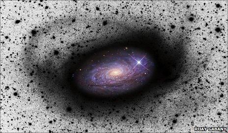 Spiral galaxy eating a dwarf galaxy - D Martínez-Delgado (MPIA)