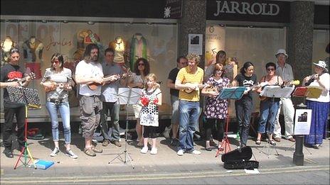 Members of the Norwich Ukulele Society in the city centre raising money for charity