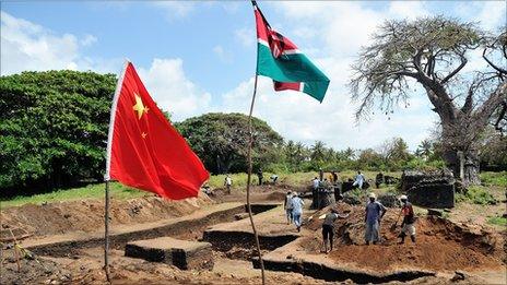 A Chinese and a Kenyan flag flutter above the excavation site