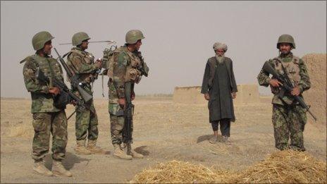 ANA soldiers about to search a compound in formally Taleban controlled territory outside Kandahar