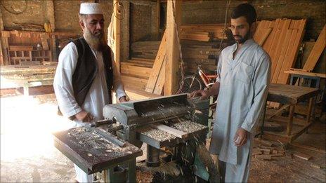 Men at work at a saw mill - one of the very few places in Shangla with a working generator