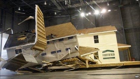 Damage after two homes are pounded by a simulated hurricane