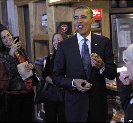 President Barack Obama eats a donut