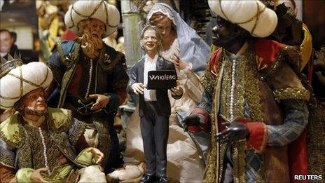 A statuette of Julian Assange in the creche