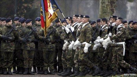 German and French soldiers parade together in Strasbourg, 10 December