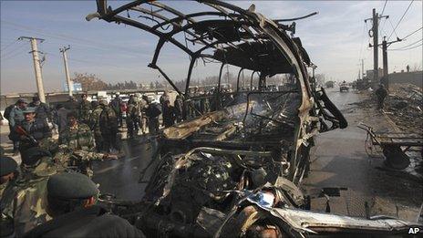 Remains of an army bus hit by militants in Kabul on Sunday