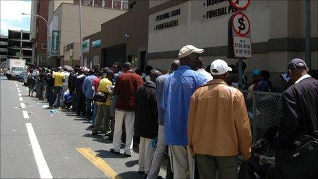 Thousands of Zimbabwe migrants outside a Home Affairs office in Johannesburg queuing for permits, December 2010