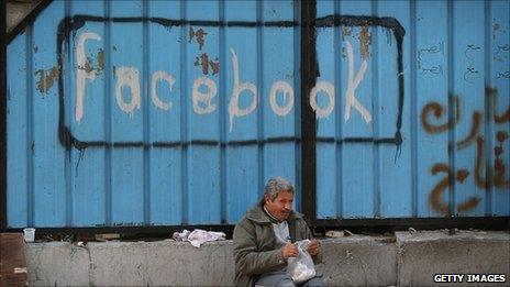 A gate sprayed with the word 'Facebook' in Tahrir Square