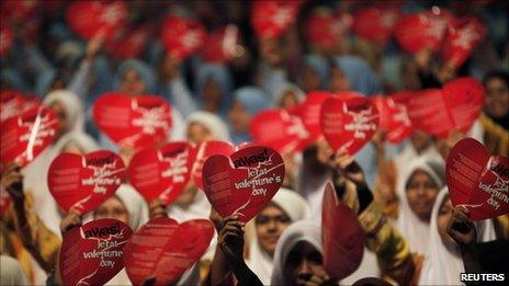 Women shout slogans for the anti-Valentine's Day Campaign, near Kuala Lumpur on 11 February 2011