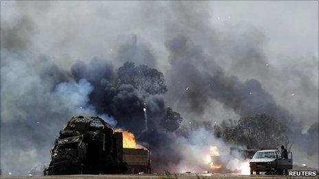 burning vehicles near Benghazi