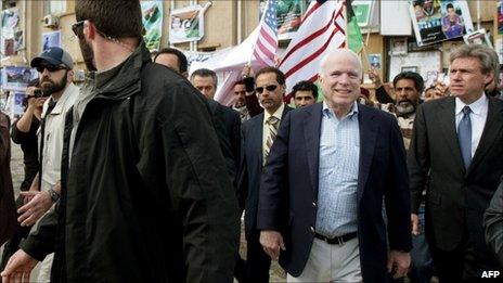 US Sen John McCain (C) tours Benghazi, Libya (22 April 2011)