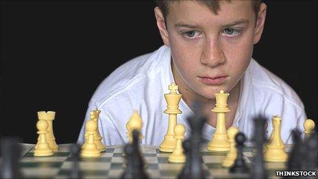 boy playing chess