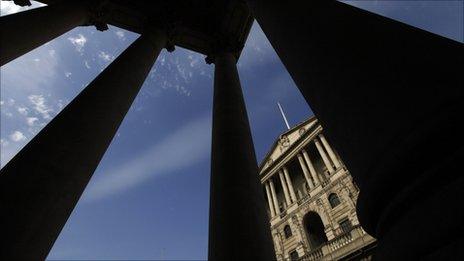 The Bank of England seen between pillars in the City of London
