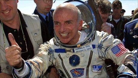 US space tourist Dennis Tito celebrates after his landing near the town of Arkalyk in Kazakhstan on 6 May 2001