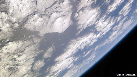 A blue and white part of Earth against the blackness of space. Photo taken from the space shuttle Atlantis in May 2010