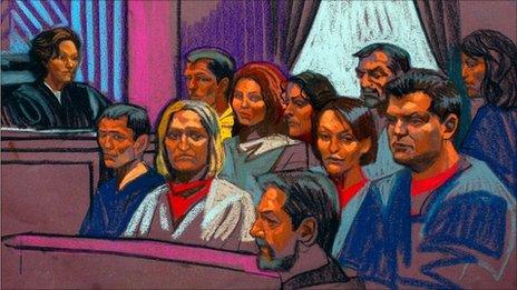 Russian spy suspects in a Manhattan courtroom sketch, 8 July 2010. Back row, from L to R: Mikhail Semenko, Anna Chapman, Vicky Pelaez, Juan Lazaro and Patricia Mills. Front row, from L to R: Michael Zottoliare, Tracey Lee Ann Foley, Donald Howard Heathfield, Cynthia Murphy and Richard Murphy.