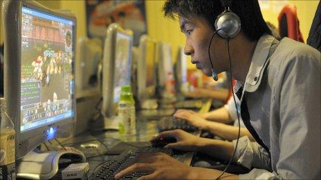 A Chinese man plays online games at an internet cafe in Beijing (file photo)
