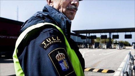 A Swedish customs officer stands at the Oeresund Bridge with Denmark, 6 May 2011