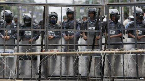 Nepalese police guard the restricted area around the constitutional assembly