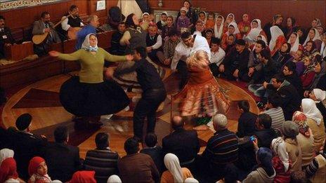 Alevi faithful dance at a religious service in Turkey