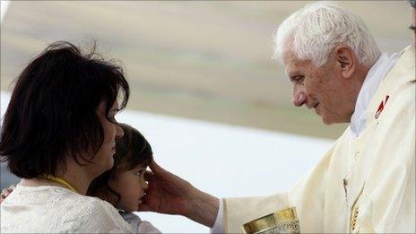 Pope Benedict blesses a girl during Mass at the hippodrome in Zagreb, Croatia, on 5/6/11