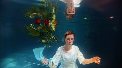Helen Morton of the Three Bugs Fringe Theatre company performs Ophelia drowning in the Apex Hotel swimming pool