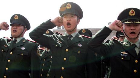 Soldiers salute the national flag as China celebrates Youth Day on May 4, 2011 in Shenyang, Liaoning Province of China