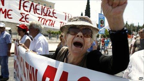 An elderly protester shouts slogans during a rally against the government's latest austerity measures