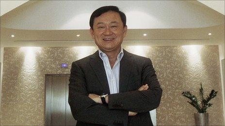 Thailand's former Prime Minister Thaksin Shinawatra poses for a photograph at his residence in Dubai